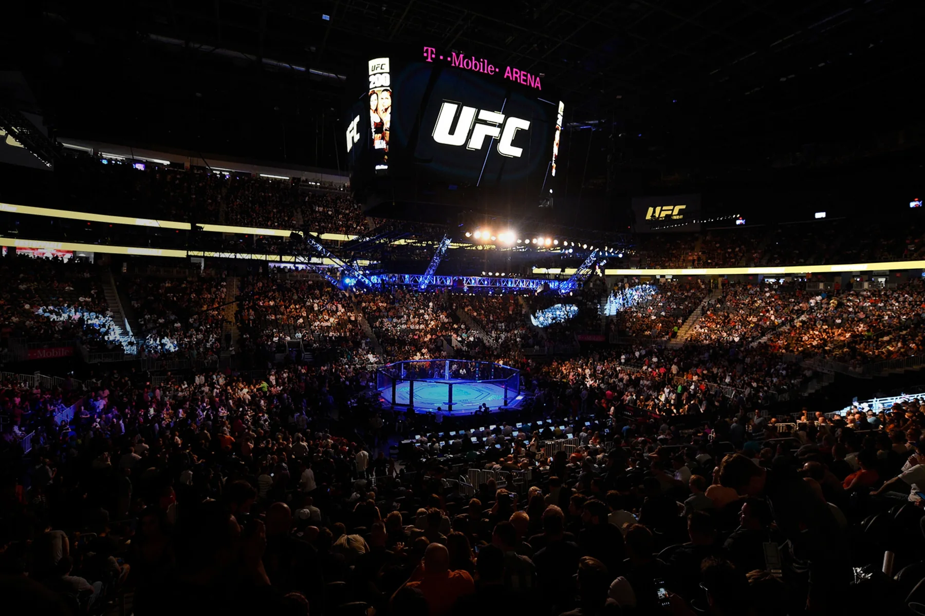 A UFC event setup inside T-Mobile Arena, whose official ticket pages route fans to AXS