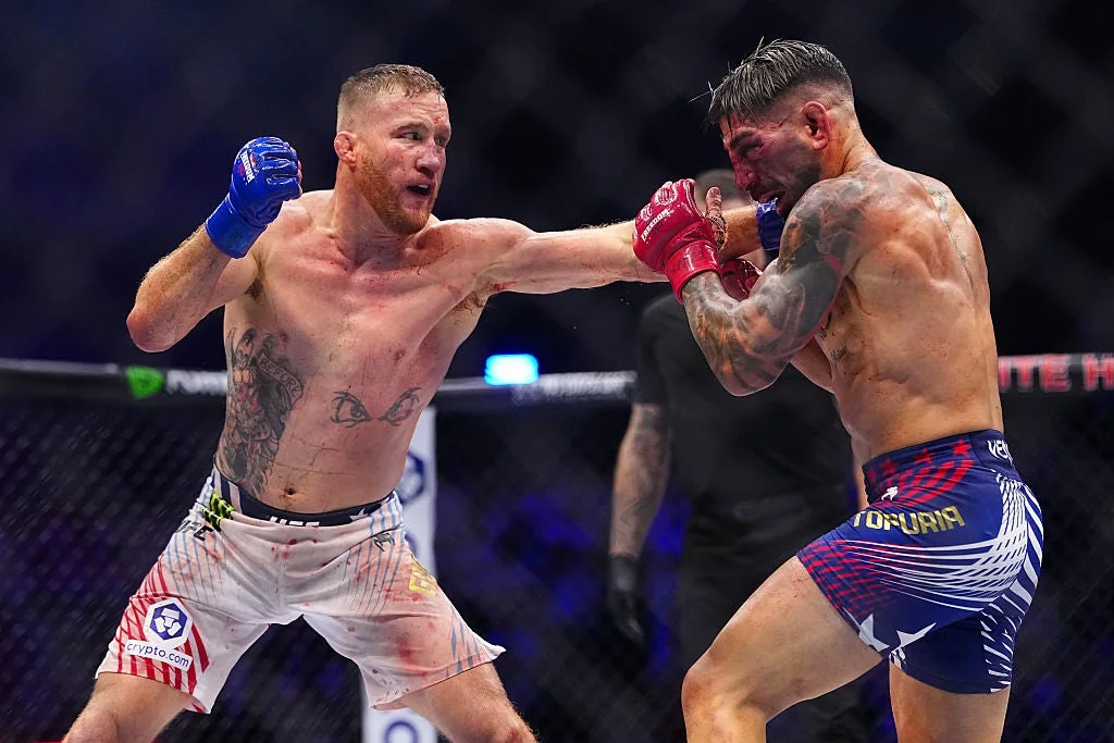 Justin Gaethje strikes Ilia Topuria during the UFC Freedom 250 lightweight title fight