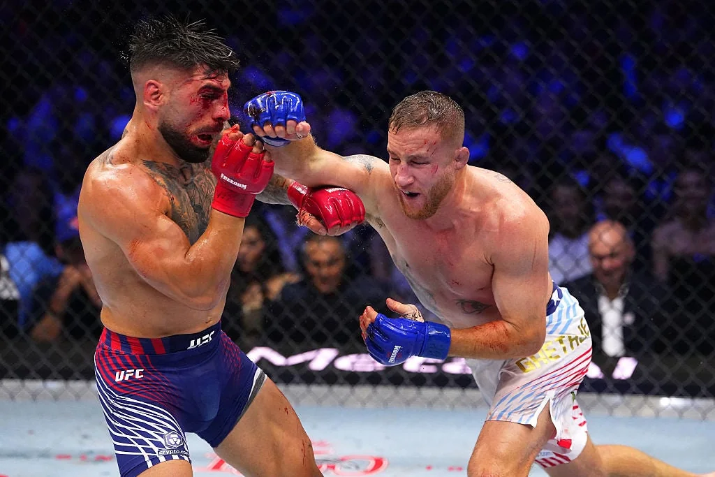 Justin Gaethje strikes Ilia Topuria during their UFC Freedom 250 lightweight title fight