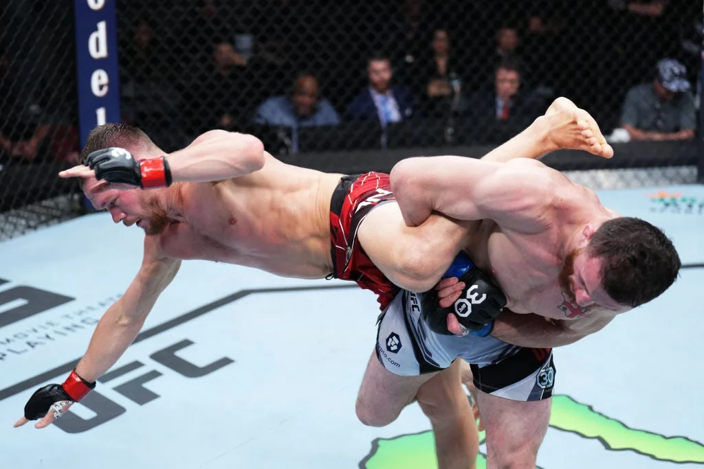 Merab Dvalishvili takes down Petr Yan during their first UFC meeting in 2023