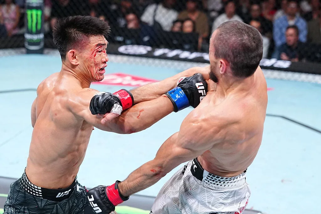 Song Yadong punches Umar Nurmagomedov during the UFC Shanghai main event