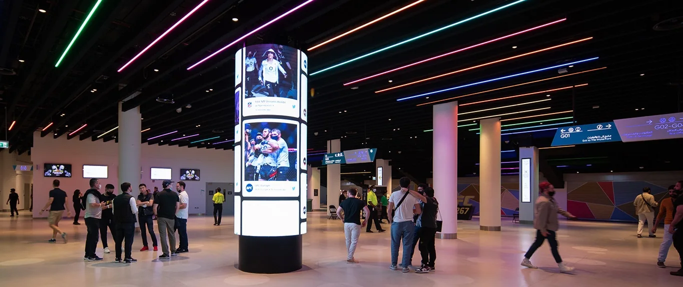 UFC fans moving through the Etihad Arena lobby on fight night