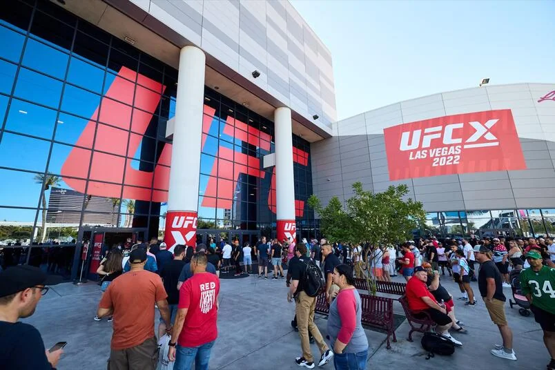 UFC fans queue outside the Las Vegas Convention Center during International Fight Week