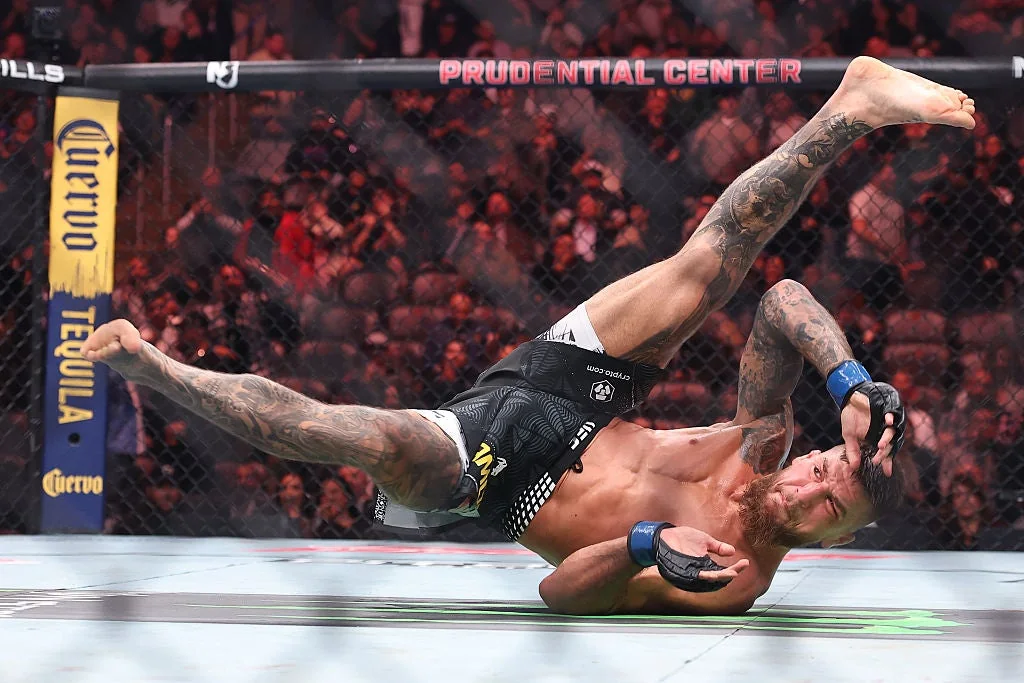 Yaroslav Amosov lifts Joel Alvarez during a takedown at UFC 328